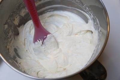 Cream cheese, condensed milk, heavy whipping cream being beat all together