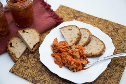 Russian Canned Fish in Tomato Sauce next to 3 slices of bread on a plate