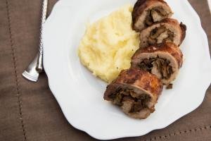 Mushroom Pork Roulade on a plate with mashed potatoes