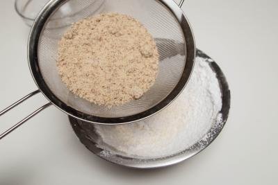 Almond flour and sugar being sifted