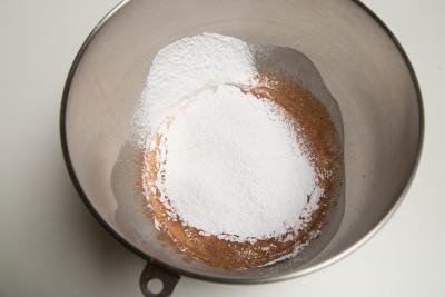 Cocoa, powdered sugar, and whipped cream in a bowl