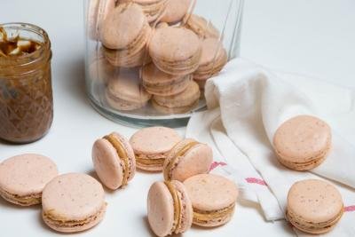 Dulce De Leche Macarons spread out on the table