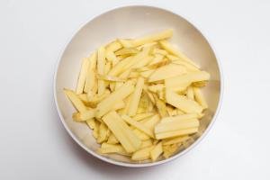 potatoes cut into long strips in a bowl