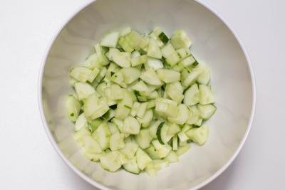 Peeled and diced cucumbers in a large bowl