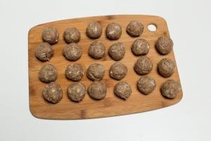 Formed meatballs on a cutting board