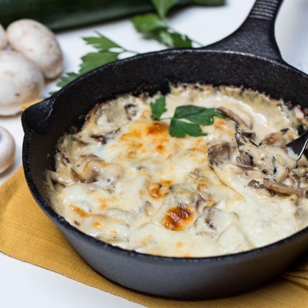 Alfredo Zucchini Bake in a small cast iron pan