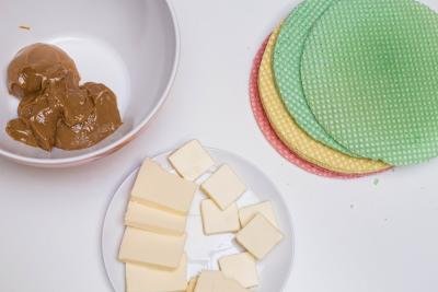 Cake wafers, a plate with butter and a bowl with dulce de leche on the table