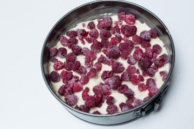 frozen raspberries placed onto the batter in the baking pan