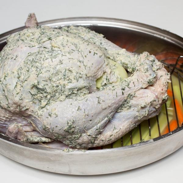 Herbed buttered turkey on a baking pan