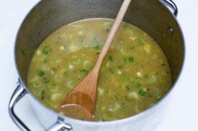 Chicken broth added to pot with vegetables
