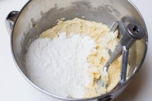 Flour being added into the bowl with the sugar mixture