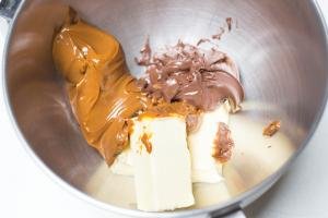 Dulce de leche, butter and nutella all placed into one mixing bowl