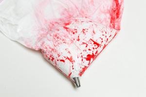 Meringue mixture placed into the bag with the food coloring