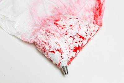 Meringue mixture placed into the bag with the food coloring