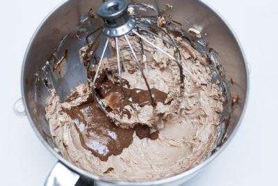 Chocolate butter cream in a mixing bowl