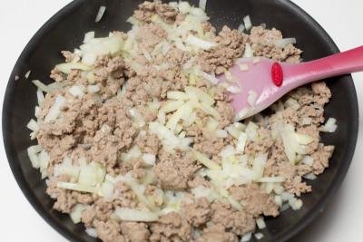 Meat onion in a skillet for pierogi filling
