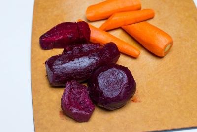 Beets and carrots on a cutting board