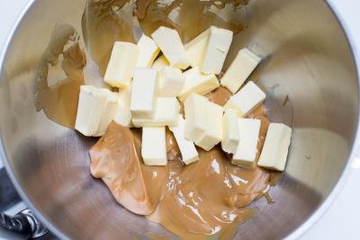 Butter and condensed milk placed into one bowl