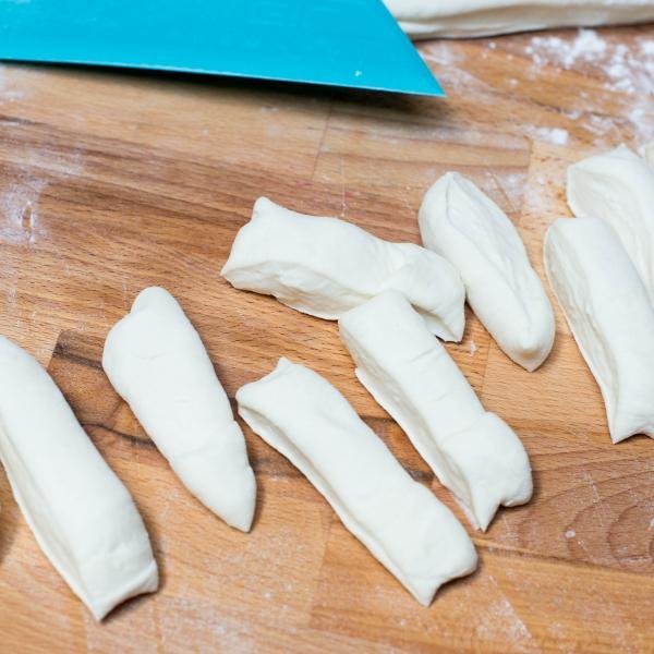 garlic knot dough cut into strips