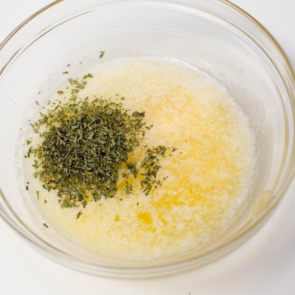 Oil, melted butter, minced garlic and parsley all in one bowl