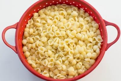 Macaroni in a strainer