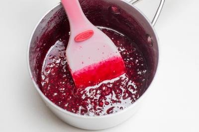melted sugar and raspberries in pot
