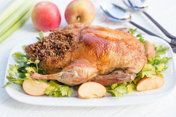 Baked Duck on a serving tray with garnish