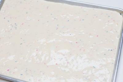 Cake batter poured into a baking pan