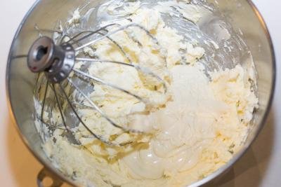 White chocolate added into the butter and cream cheese mixture in the mixing bowl