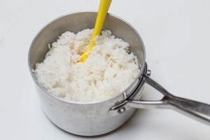 Rice on a pot with a spatula