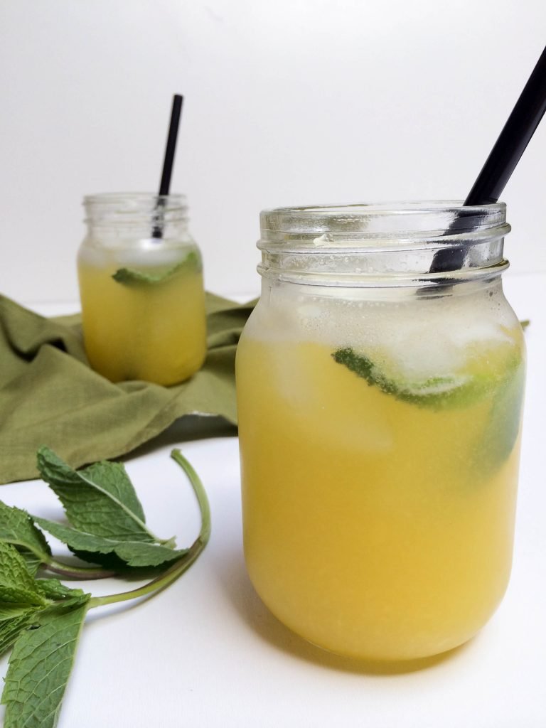 Sparkling Mango Drink in a jar with a straw