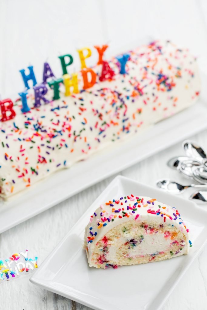 Birthday Cake Roulade slice on a plate