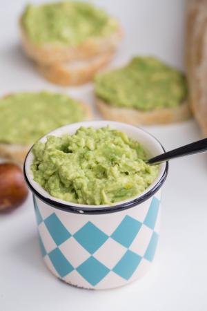 Garlic Avocado Spread in a little condiment container