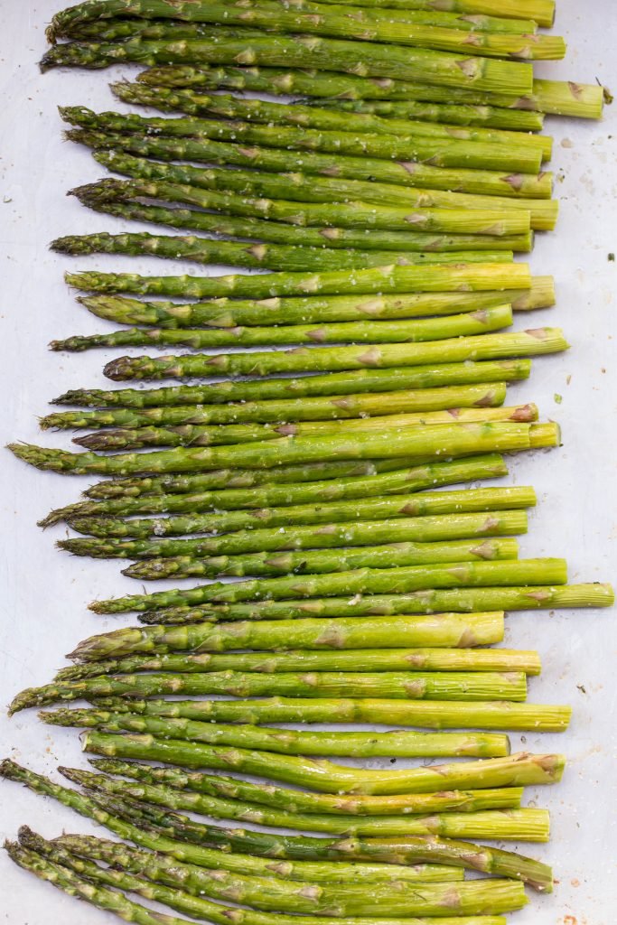 Seasoned Asparagus on a baking pan