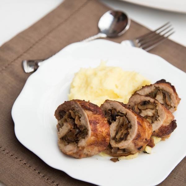 Mushroom Pork Roulade on a plate with mashed potatoes