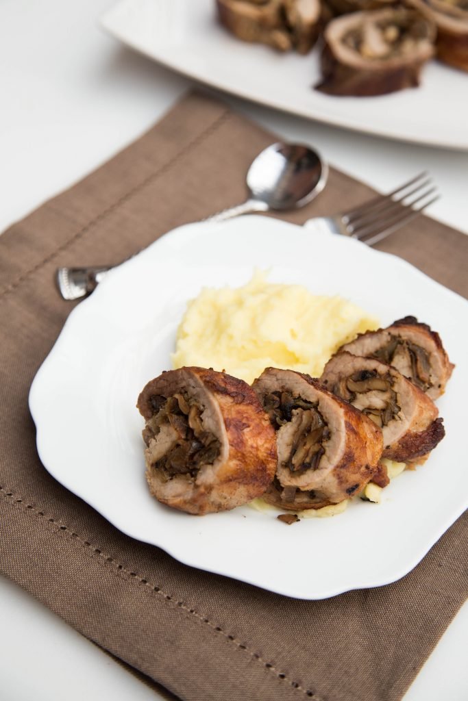 Mushroom Pork Roulade on a plate with mashed potatoes