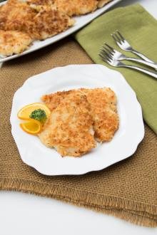 Panko Fish on a plate with a slice of orange