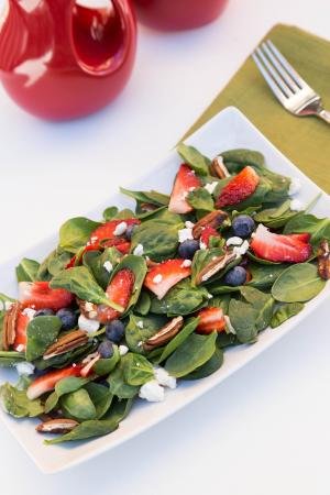 Berry Spinach Salad on a long rectangular plate
