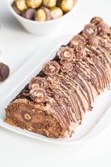 Ferrero Rocher Cake Roll on a long rectangular plate