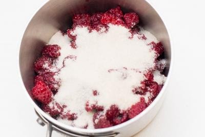raspberries and sugar in a pot