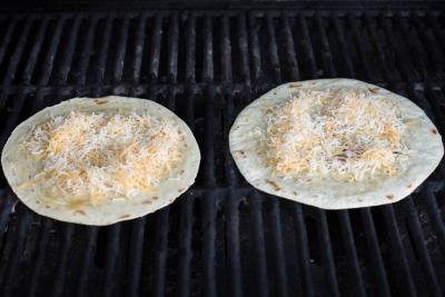 Tortillas on a grill with cheese on the tortilla