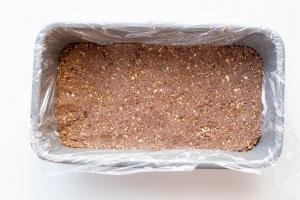 Healthy Chocolate Coconut Bar ingredients pressed down into a line baking pan