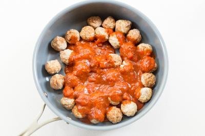 Meatballs in a skillet with Italian pasta sauce