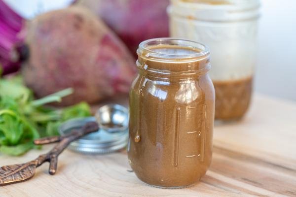 Beet Salad Dressing in a jar on a cutting board