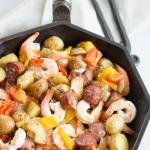One Pan Sausage and Vegetable Bake in a small iron skillet