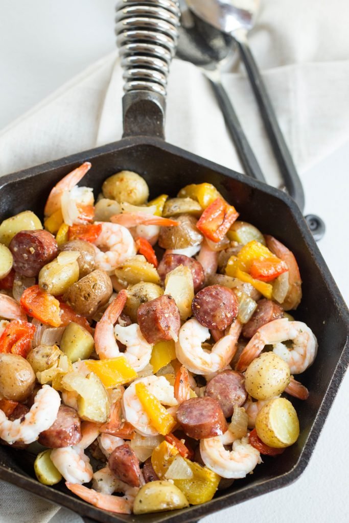 One Pan Sausage and Vegetable Bake in a small iron skillet