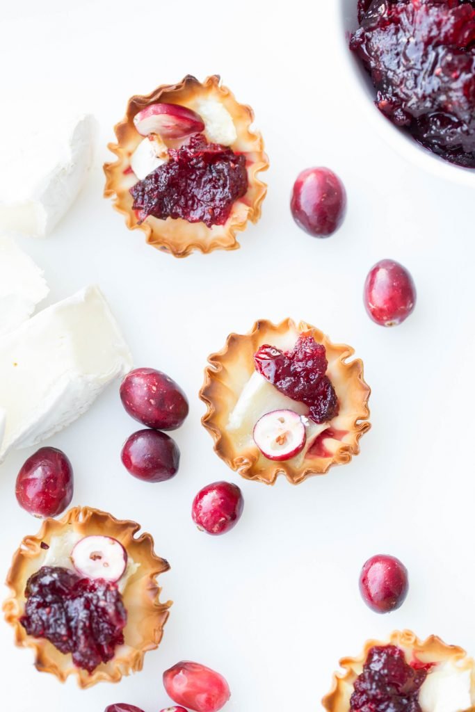 Brie and Cranberry Bites on a cutting board