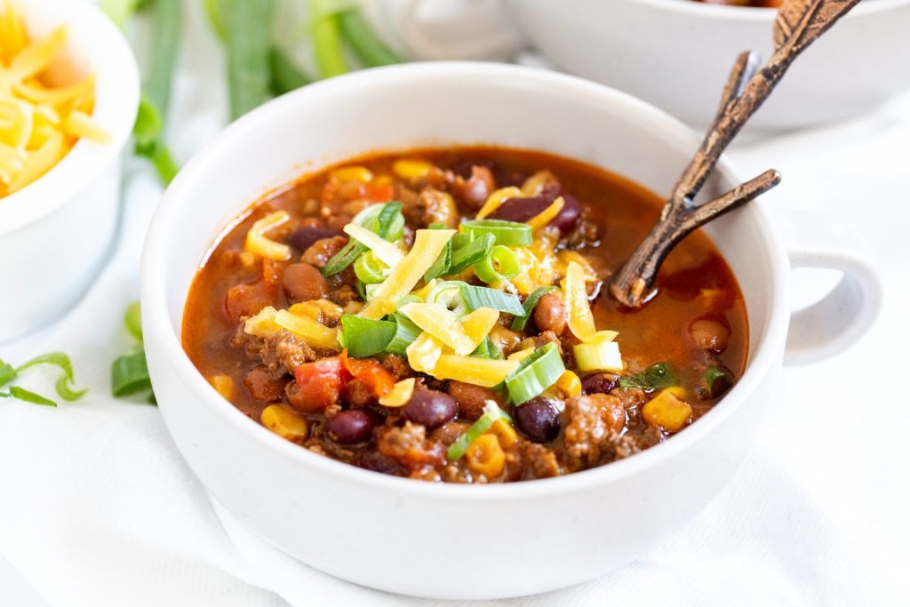 Chili in a bowl with a spoon