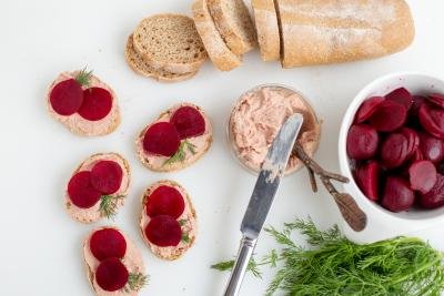Smørrebrød in the making, bread, pate and pickled beets