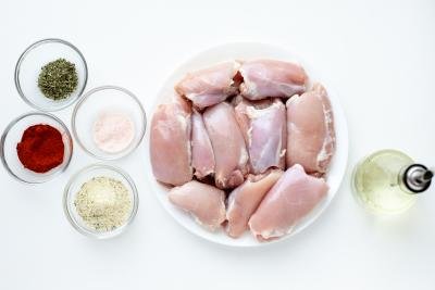 Ingredients in plates for Instant Pot Chicken Thighs